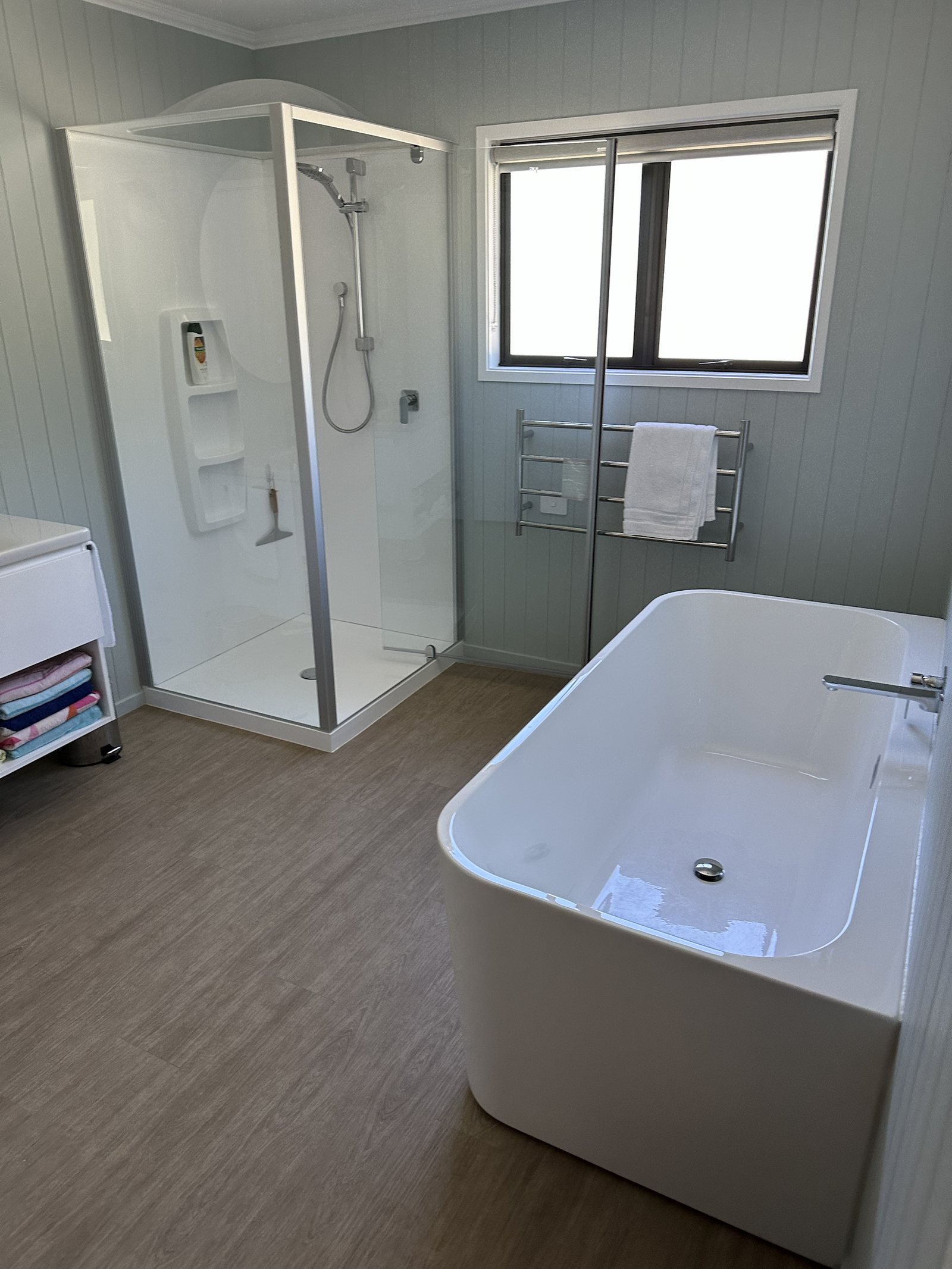 Bathroom with freestanding bath and shower