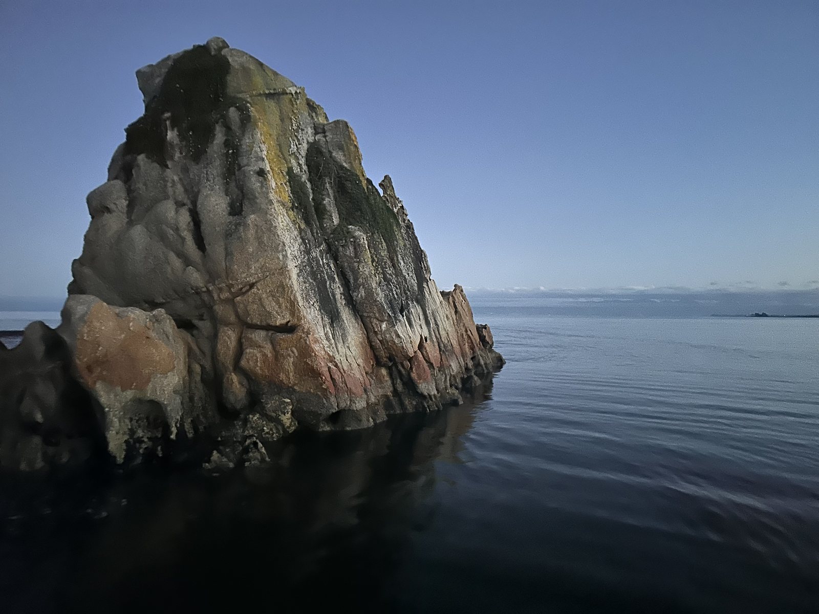 Close view of Split Apple Rock from the water